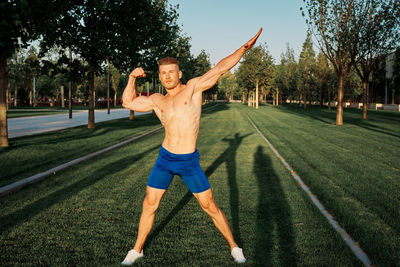 Full length of man exercising at park