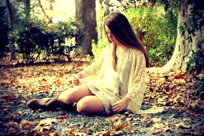 Woman standing in forest