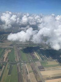 Aerial view of agricultural field against sky