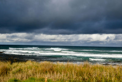 Scenic view of seascape against cloudy sky