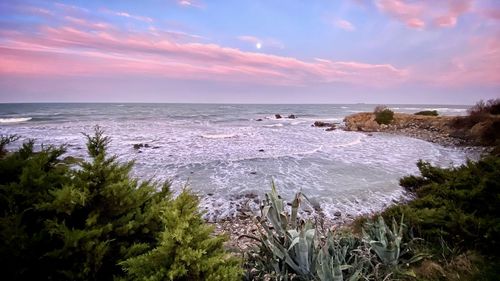 Scenic view of sea against sky during sunset