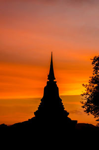 Silhouette of temple against sky during sunset