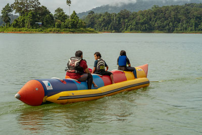 People on boat in lake