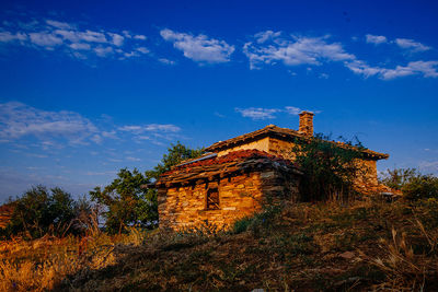 Low angle view of building against blue sky