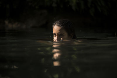 Portrait of young woman in swimming pool