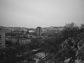 High angle view of buildings in city against clear sky