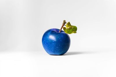 Close-up of apple over white background