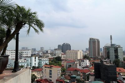 Buildings in city against sky