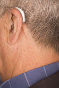Rear view of man with eyes closed