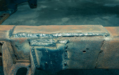 High angle view of rusty metal on ice