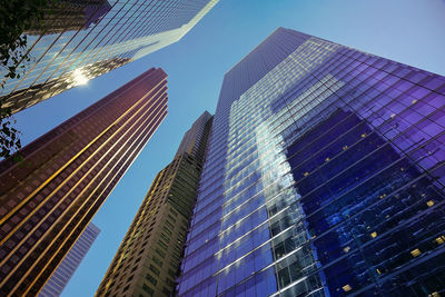 Low angle view of modern buildings against clear sky