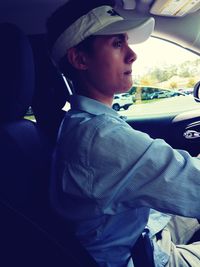 Portrait of young man in car