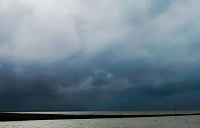 View of sea against cloudy sky