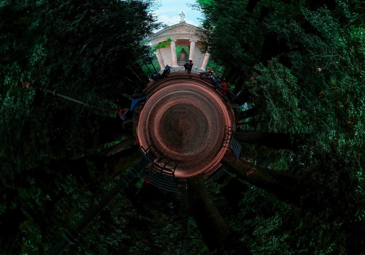 HIGH ANGLE VIEW OF BUILDING BY TREES