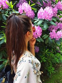 Portrait of woman with pink flowers