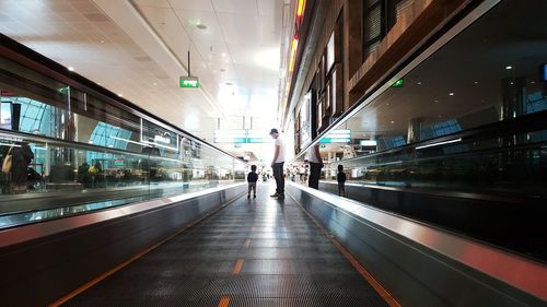 People at railroad station in city