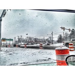 Cars on road against sky