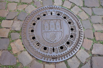 High angle view of manhole on street