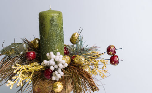 Close-up of christmas tree against white background