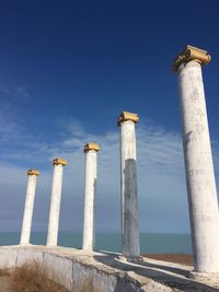 Low angle view of historical building against blue sky