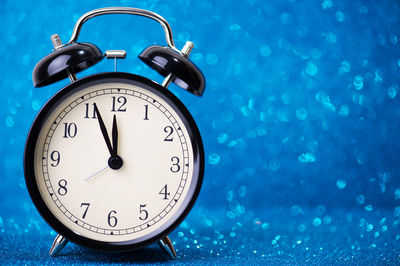 Close-up of clock on table