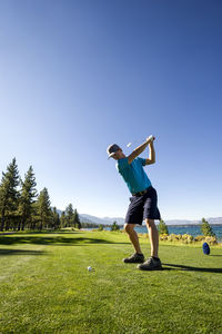 A man teeing off at edgewood tahoe in stateline, nevada.