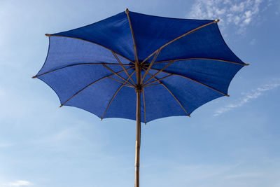 Low angle view of umbrella against sky