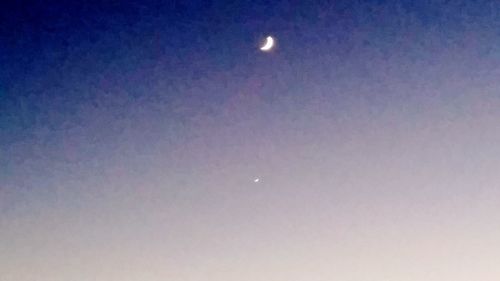 Close-up of moon against blue sky