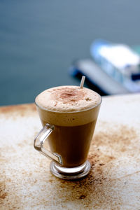 Close-up of cappuccino on table