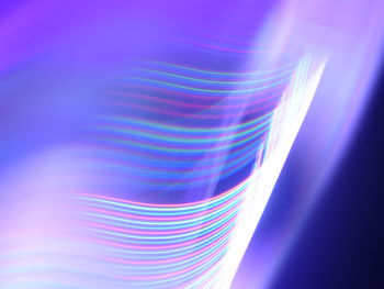Close-up of light painting against blue background