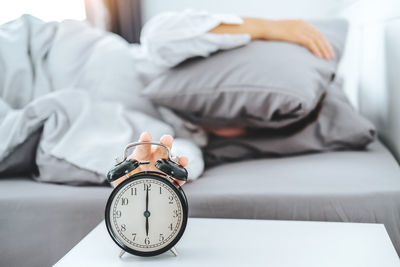 Close-up of man sleeping on bed at home