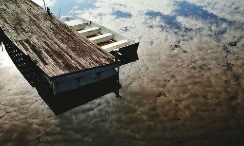 Tilt image of building against sky during winter