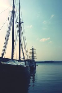 Sailboat on sea against sky