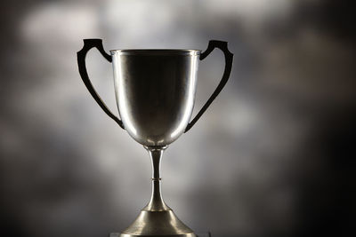 Close-up of  trophy on gray background 