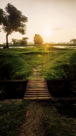 Scenic view of field against sky during sunset