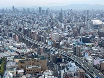 High angle view of modern buildings in city against sky