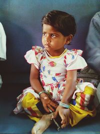 Cute boy playing on bed at home