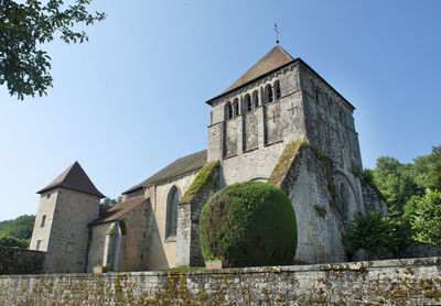 Low angle view of old building against clear sky