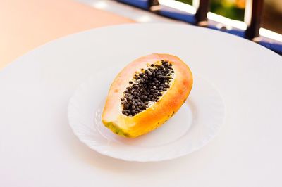 High angle view of papaya in plate on table