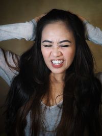 Portrait of a beautiful young woman with eyes closed