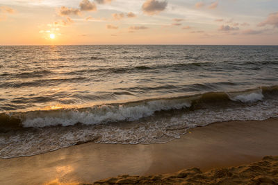 View of beach at sunset