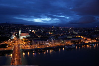 High angle view of road along built structures at night