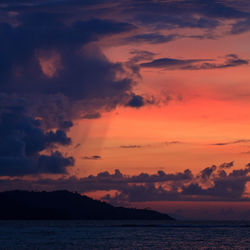 A dramatic red sky sunset taken from a remote island in indonesia