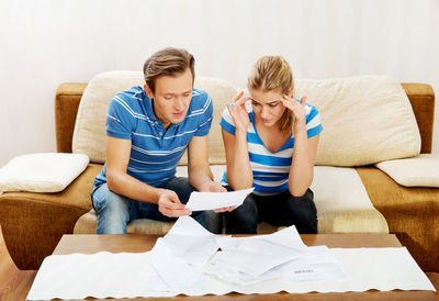Young couple sitting on sofa