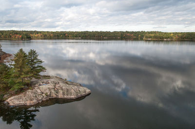 Reflection of clouds in calm lake