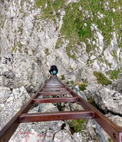 High angle view of person standing on railroad track