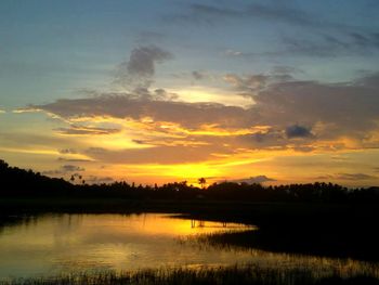 Scenic view of lake against sky during sunset