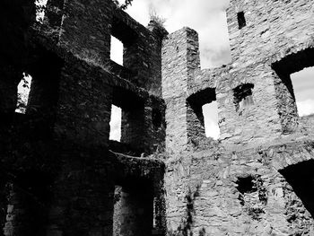 Low angle view of old ruin building against sky