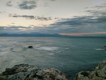 Scenic view of sea against sky at sunset