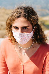 Portrait of a beautiful young woman wearing face mask